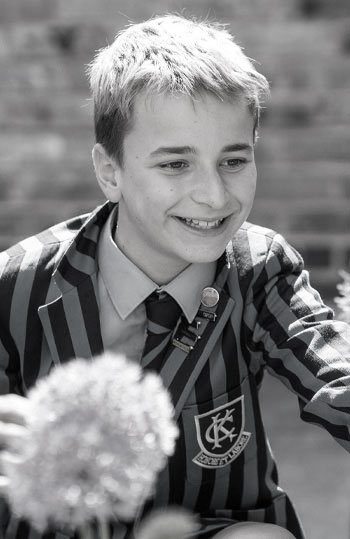 black and white photo of boy smiling