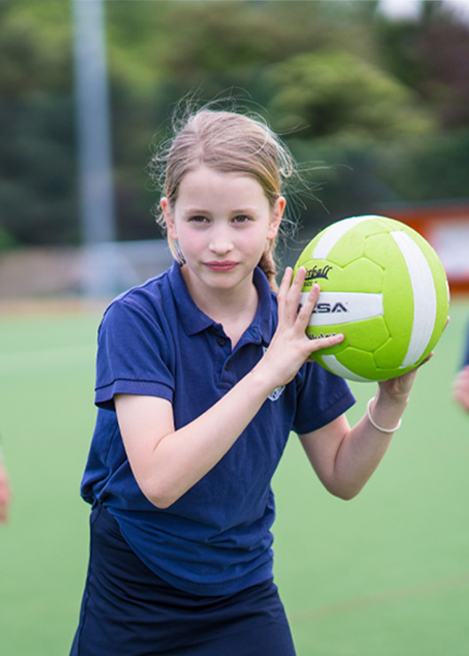 Girl holding a ball