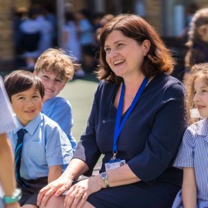 students sat outside with their teacher