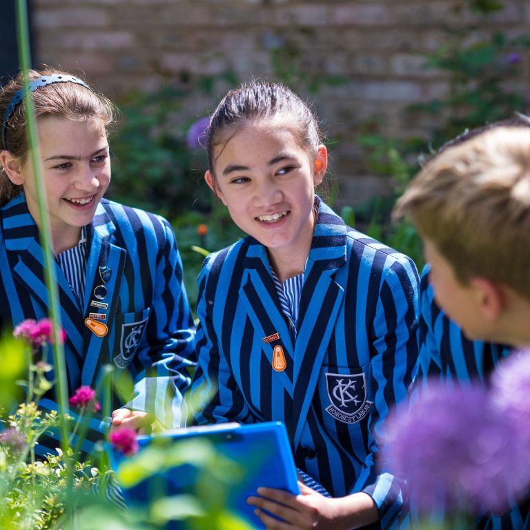 Students talking in the flowers