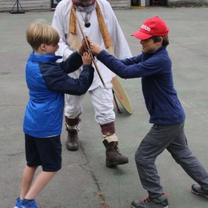 Students learning to do battle similarly to the old battles in French civilisation