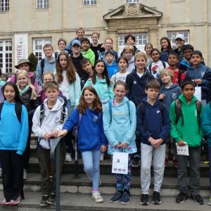 Students stood on the steps of a French museum and building