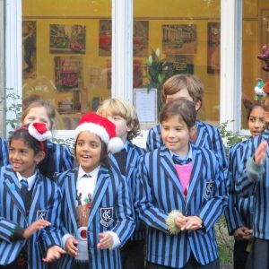 children wearing Christmas hats