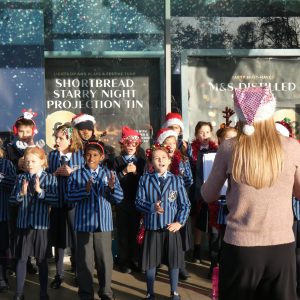 children performing at Kew Retail Park
