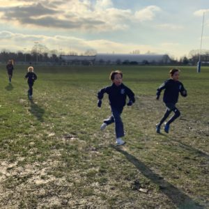 children running on the school field