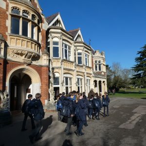 students walking to their school trip