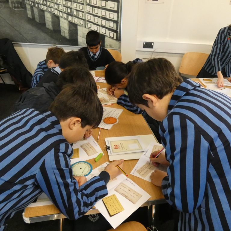 students writing on paper