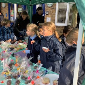 students by the table of goodies