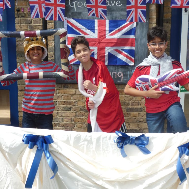 students holding inflatables