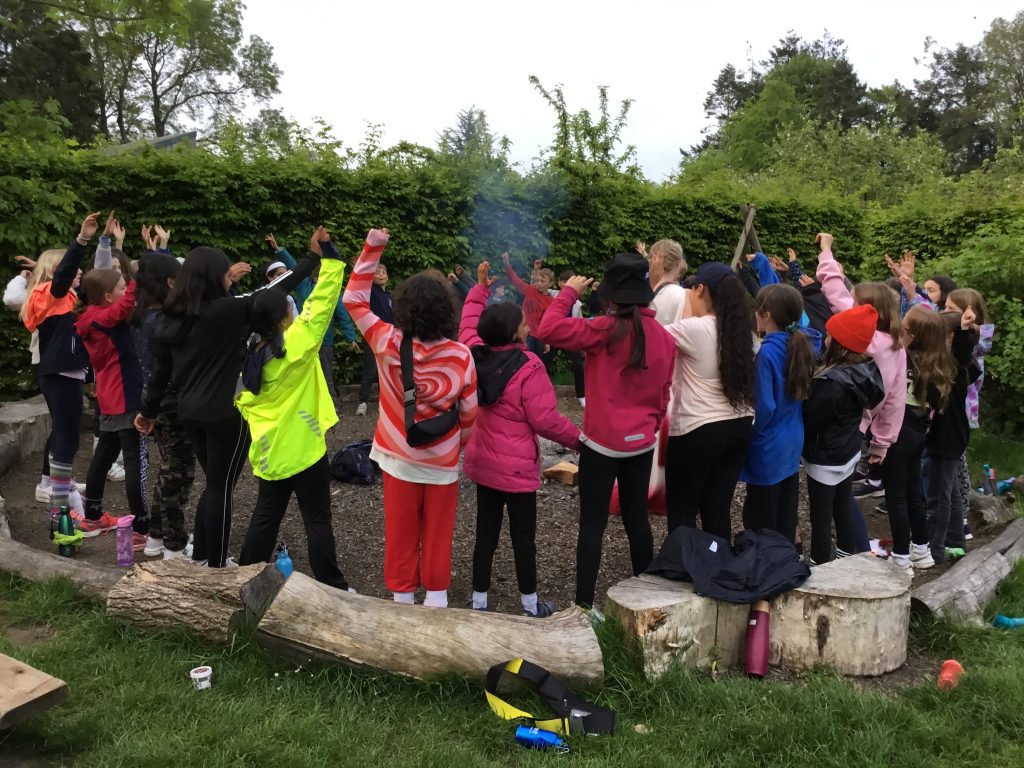 students around a fire