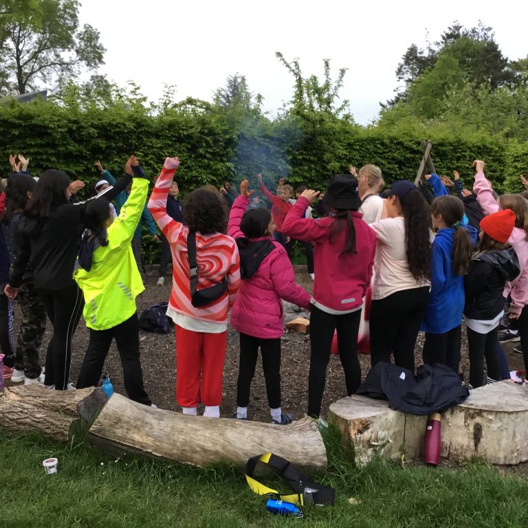 students around a fire