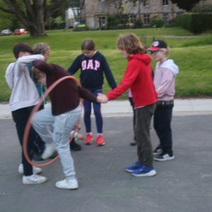 students playing with a hoop
