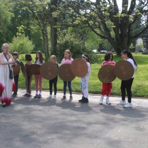 students holding shields