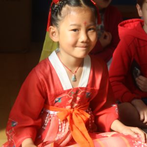 girl in traditional clothes for international day