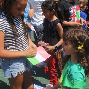 girls holding flags