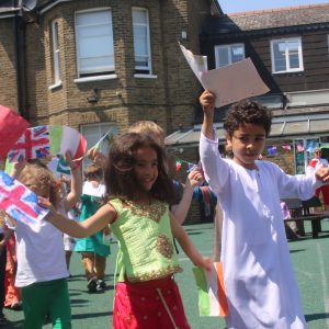 young students holding flags