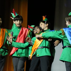 students wearing green jackets