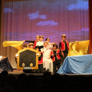 students on stage for a play