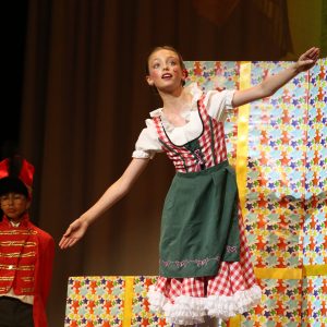 girl performing in a dress