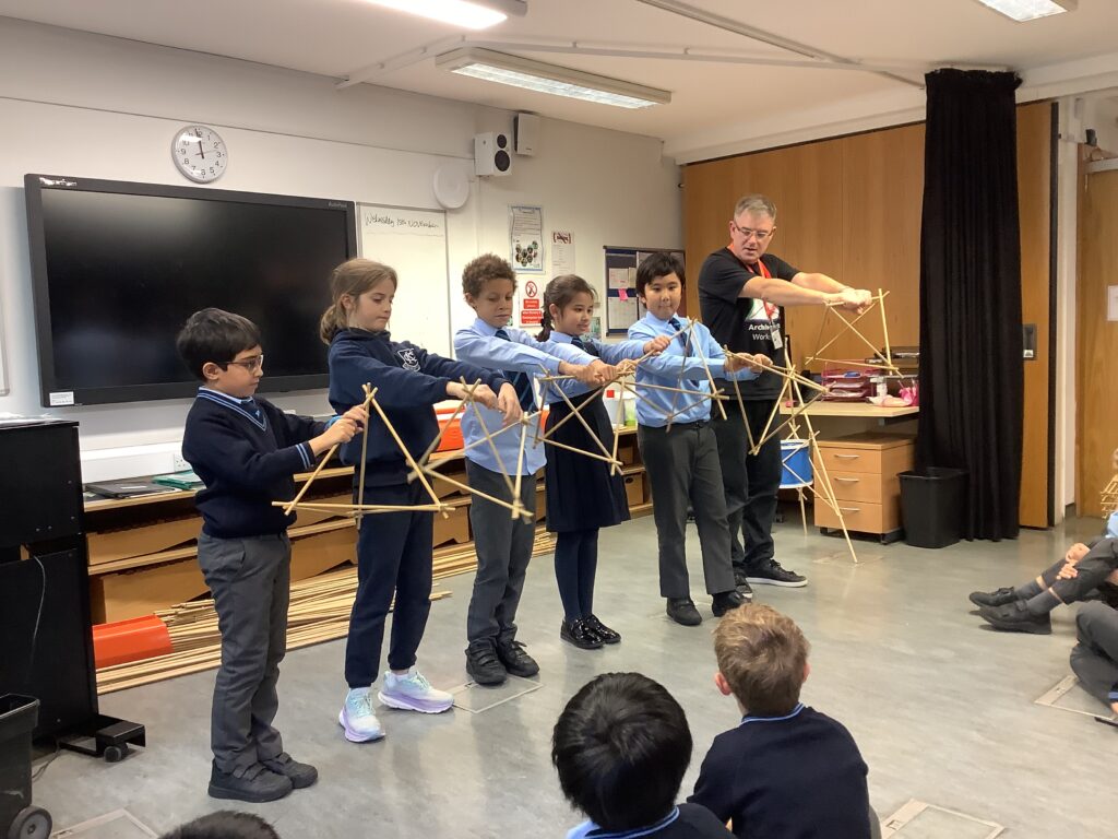 students building a model with sticks